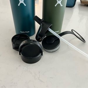 Two hydro flasks water bottles with accessory lids bundle